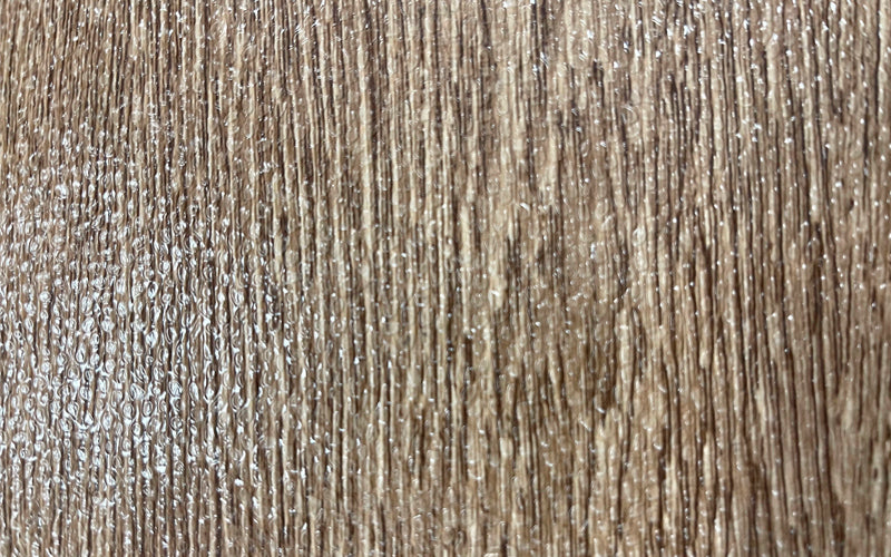 Close up image of the wood grain design on the standing desk mat.