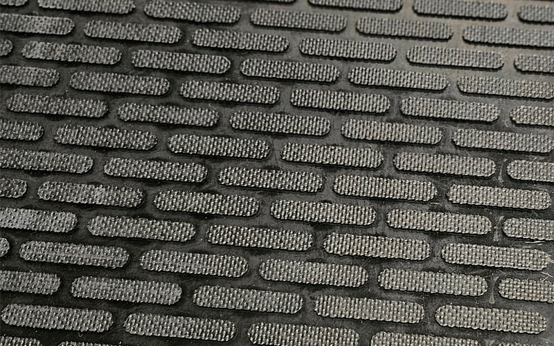 Close up image of the rubber textured top of the glow hog mat which is anti-slip and durable.