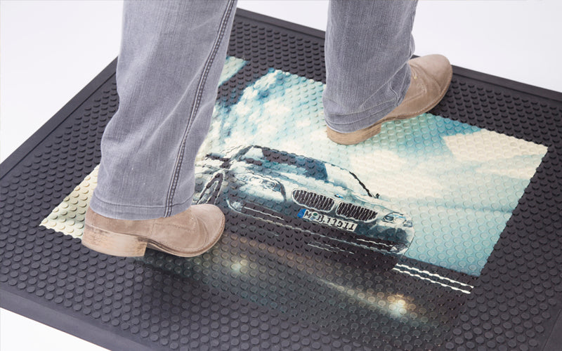 The rubber scraper logo mat provides a functional alternative to carpet topped logo mats.