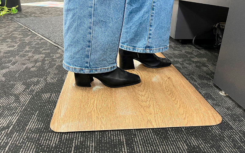 Insitu image of the standing desk mat used in an office.
