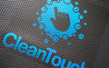 Close up image of a blue custom logo, digitally printed on a rubber scraper logo mat.