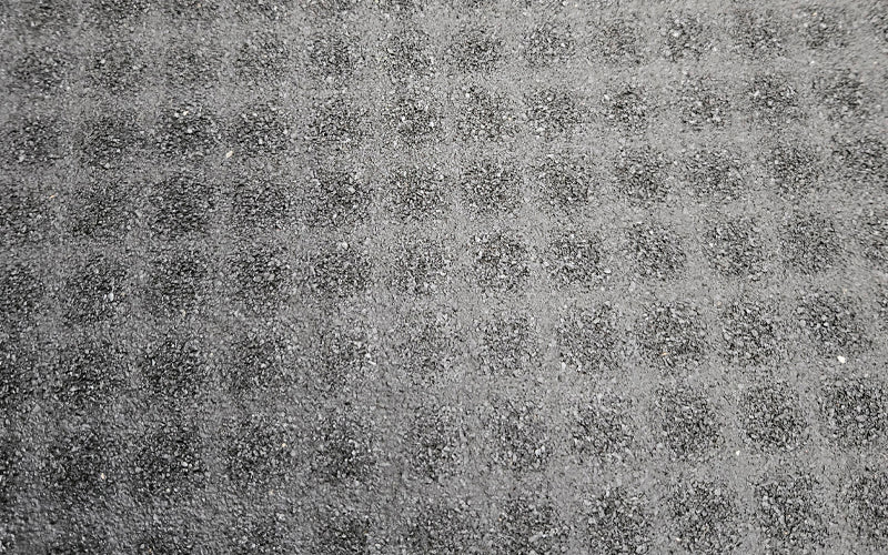 Close up image of the rubber backing of the TireTuff Royal Mat that is anti-slip