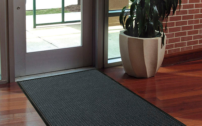 Insitu image of a rubber edged waterhog mat perfect for hospitality entryways.