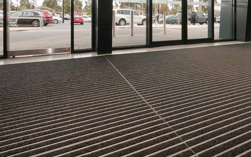 Insitu image of Aluminium Architectural Mat with Charcoal Superguard Inserts in commercial building