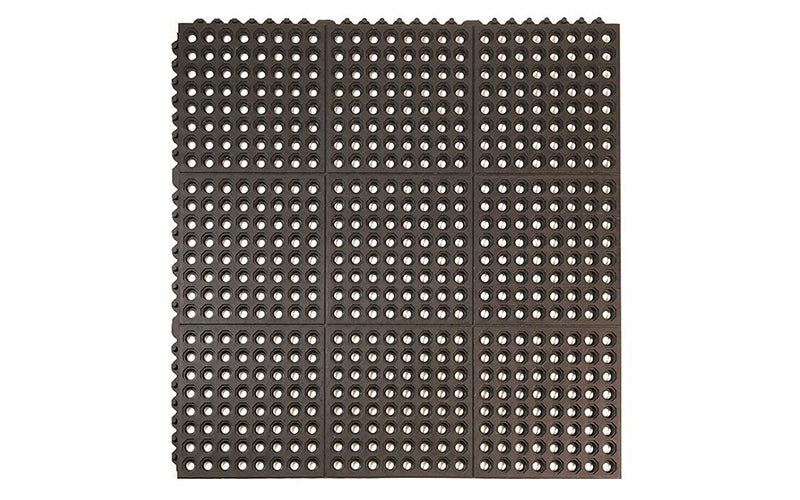 Full product image of black anti-fatigue 24/seven Interlocking mat with holes available in natural or nitrile rubber.