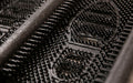 Close up product image of black rubber Mud Chucker that scrapes mud off shoes
