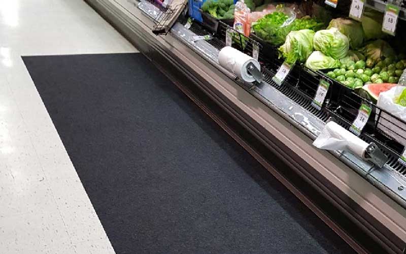 Insitu product image of black, non-slip SmartGrip Matting in fresh produce area of supermarket