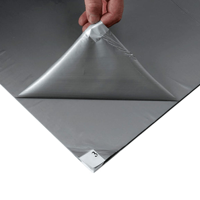 Insitu image of someone easily peeling off a used sheet of the clean room sticky mat to uncover a new layer ready to go.